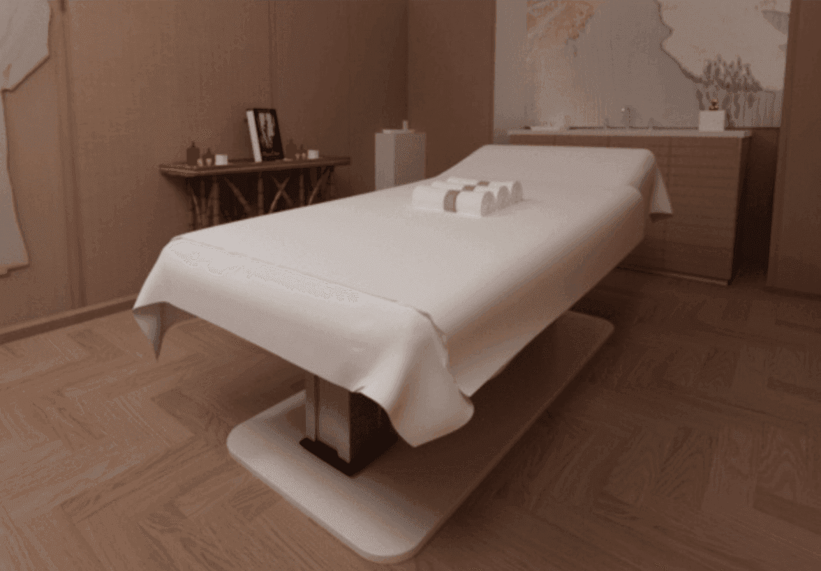 Palas Spa Treatment Table dressed in a spa room.